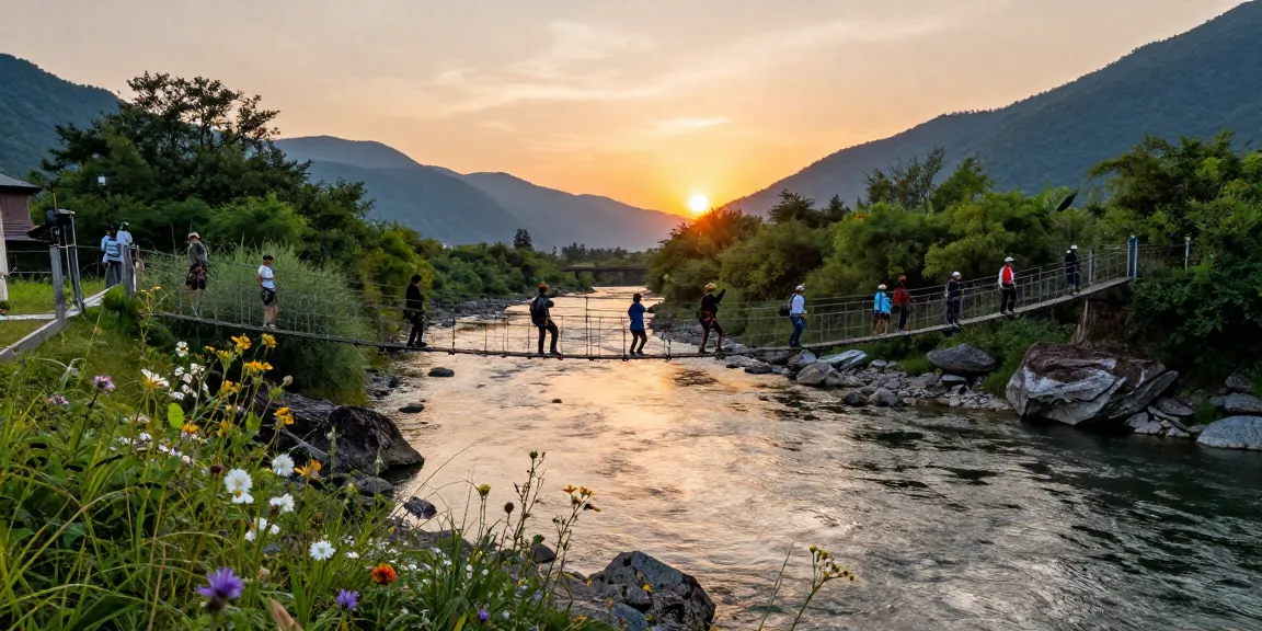 Hikers crossing a River Rope Bridge at sunset, surrounded by nature.